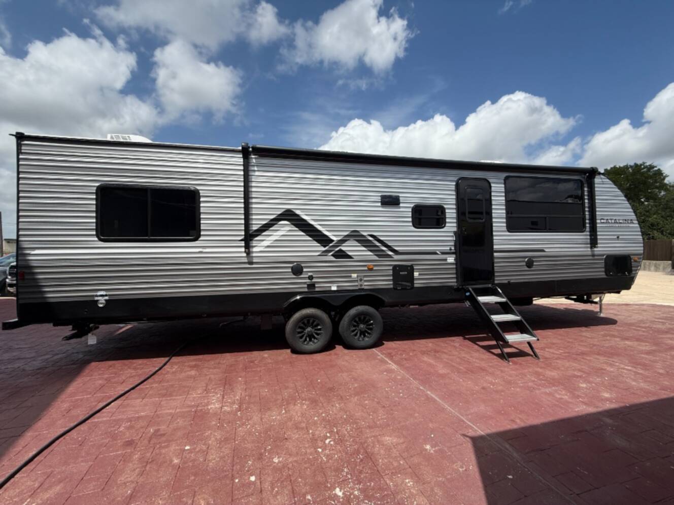 A photo of this 2027 Coachmen Rv Catalina Legacy Edition 343BHTS 2 Queen Beds
