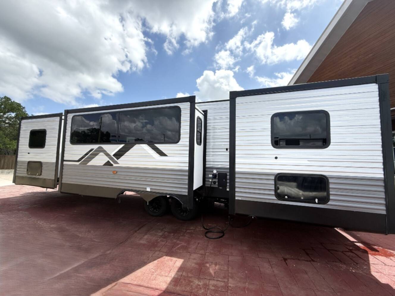 A photo of this 2027 Coachmen Rv Catalina Legacy Edition 343BHTS 2 Queen Beds