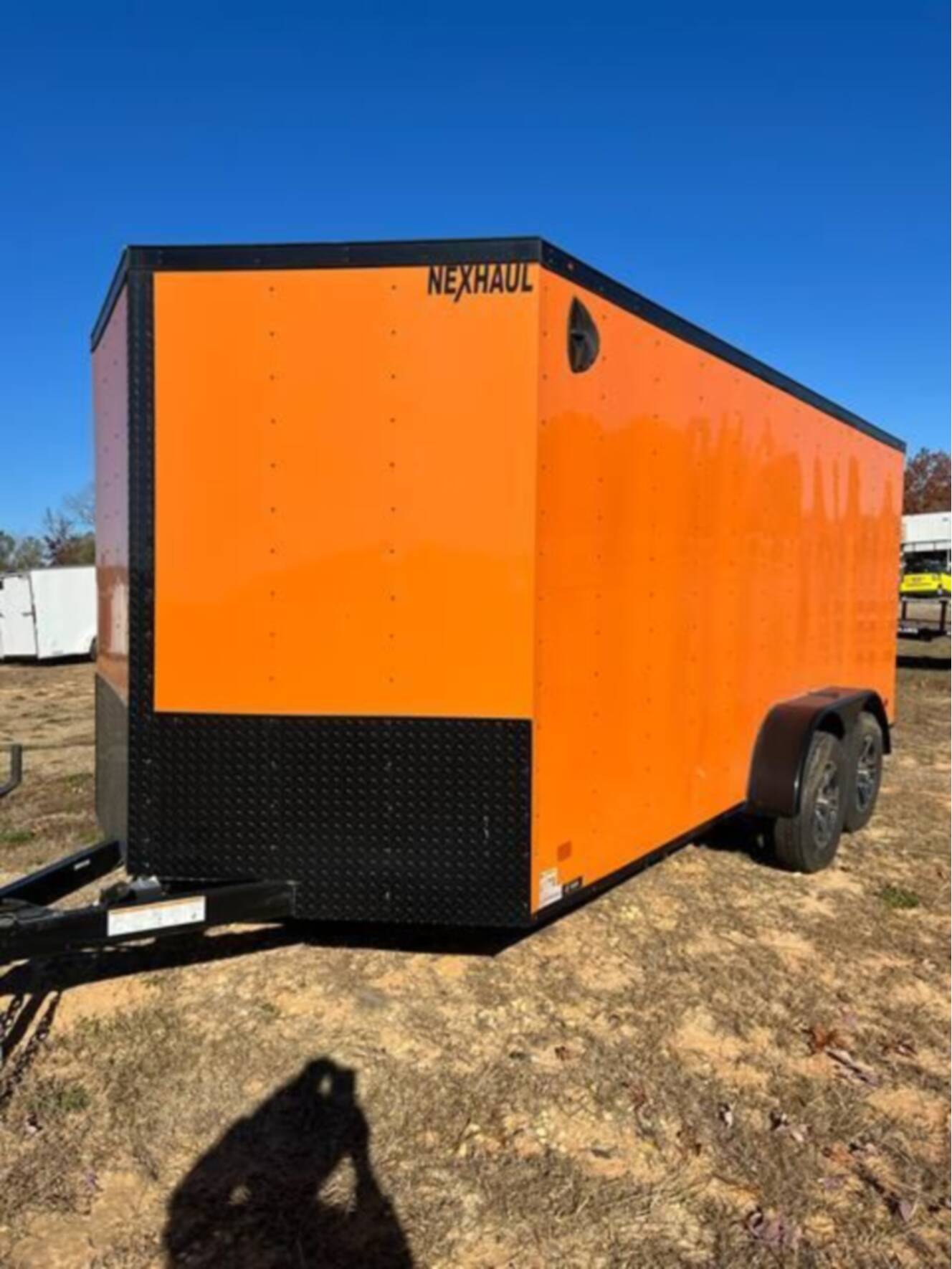 A photo of this 2023 Nexhaul Trailers 7X16 TA ORG/BLKOUT RIMS