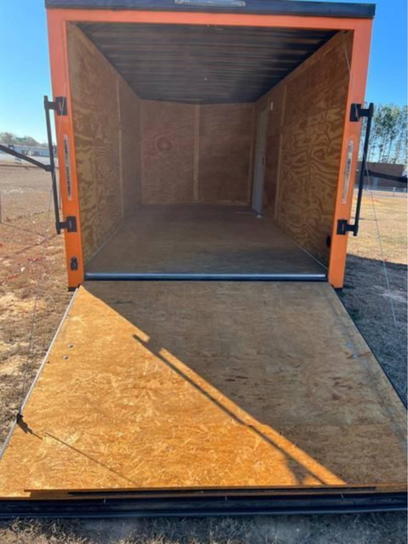 A photo of this 2023 Nexhaul Trailers 7X16 TA ORG/BLKOUT RIMS