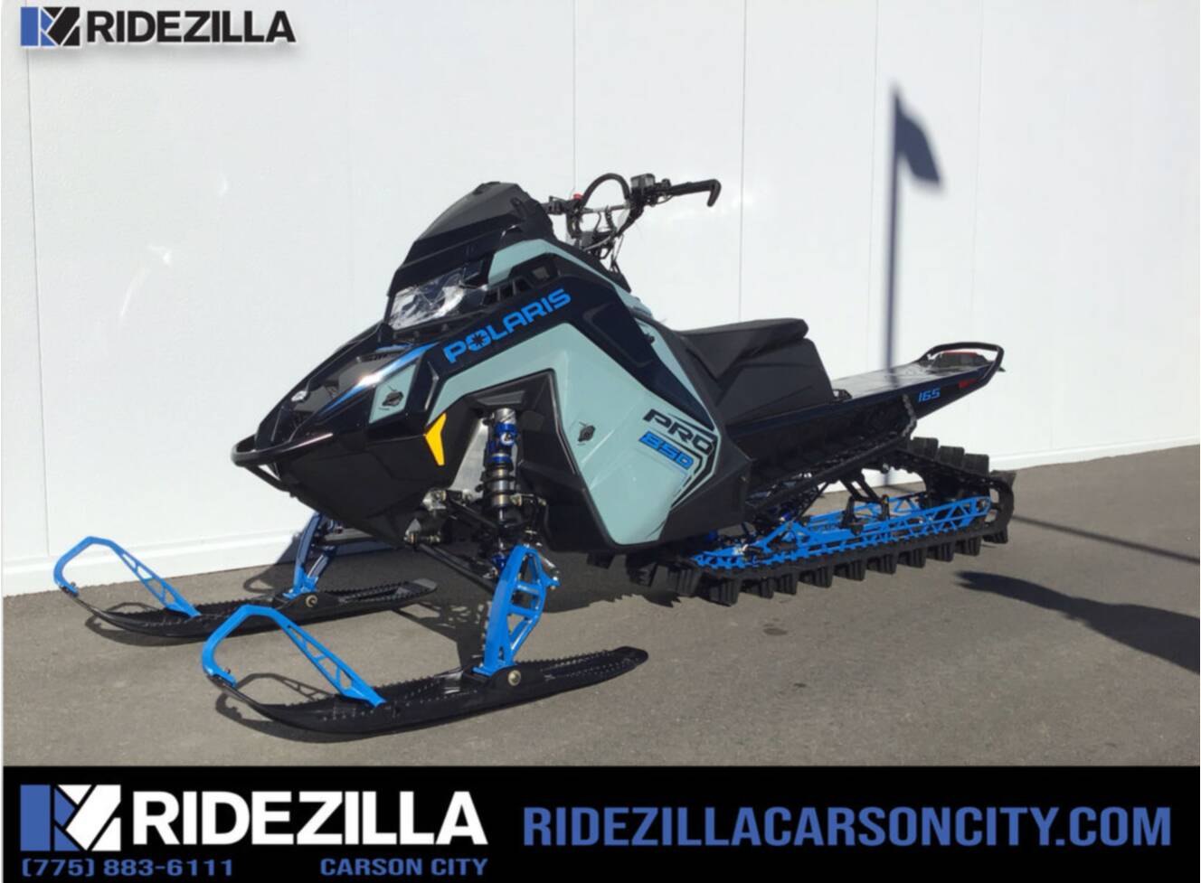 A photo of this 2026 Polaris® 850 PRO RMK 165 Hemlock Blue / Black / Velocity Blue