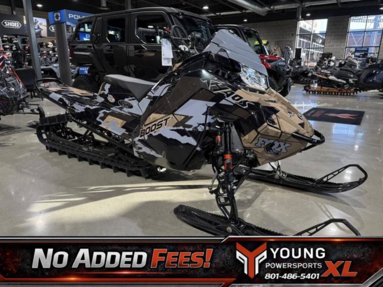 A photo of this 2026 Polaris Patriot Boost RMK Khaos 165 Gloss Black / Blue Dusk