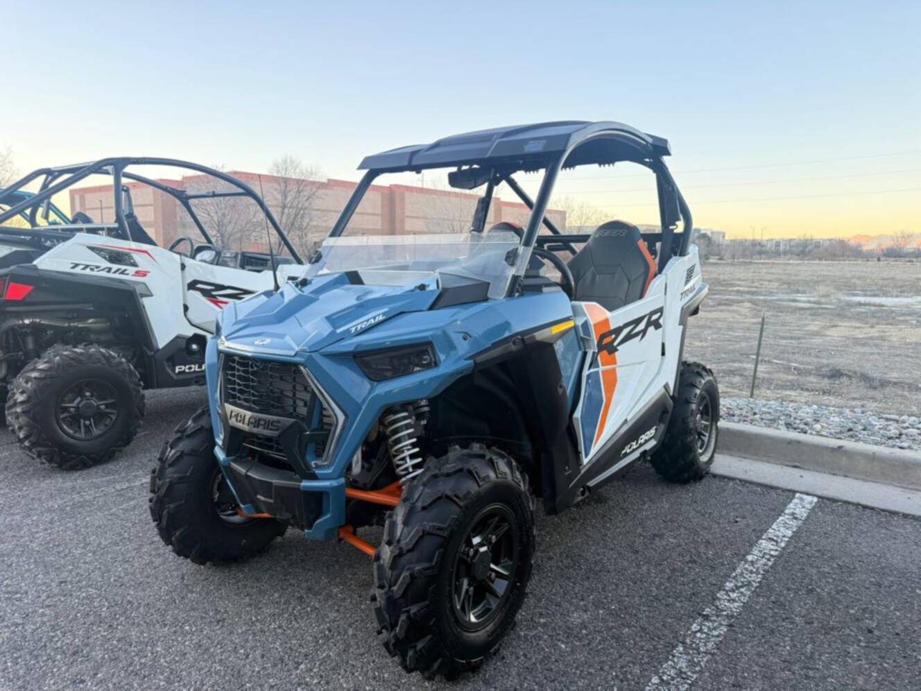 A photo of this 2024 Polaris RZR Trail Ultimate - Storm Blue / White Lightning.