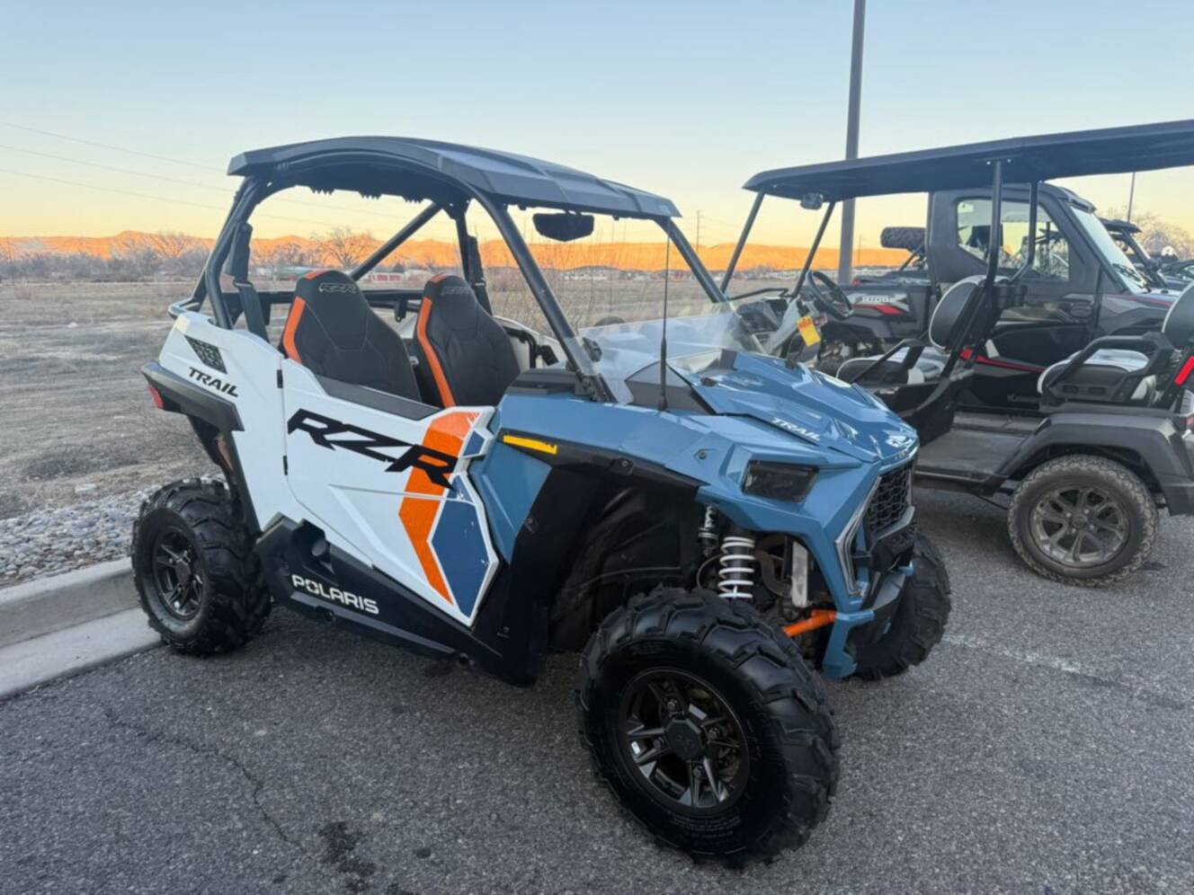 A photo of this 2024 Polaris RZR Trail Ultimate - Storm Blue / White Lightning.