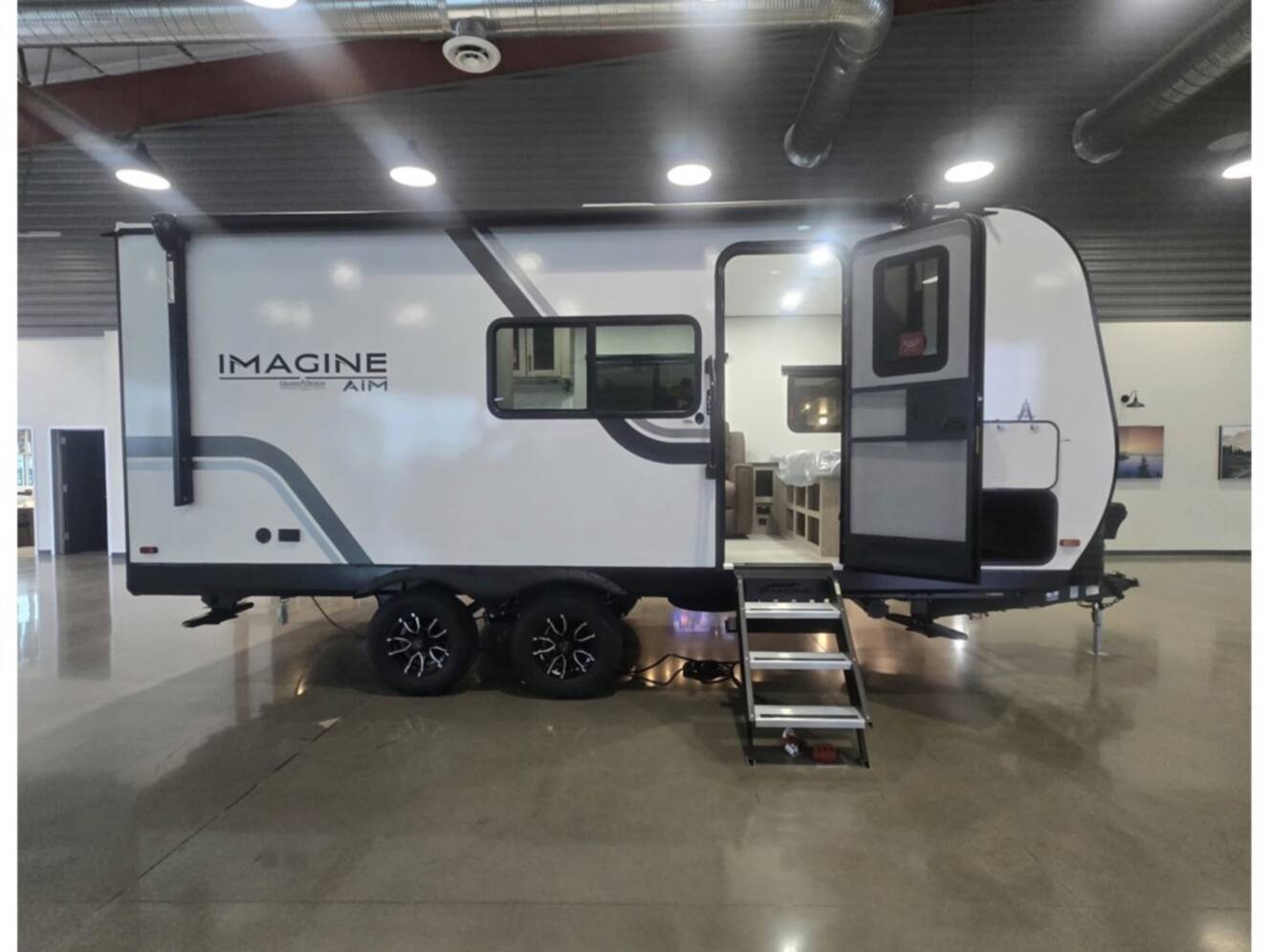 A photo of this 2026 Grand Design Imagine AIM 19MLA
