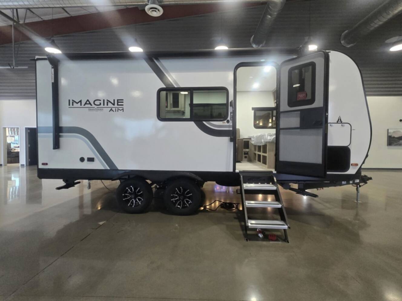 A photo of this 2026 Grand Design Imagine AIM 19MLA