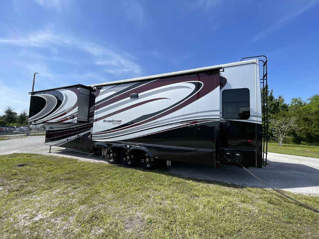 A photo of this 2023 Forest River RIVERSTONE 41RL
