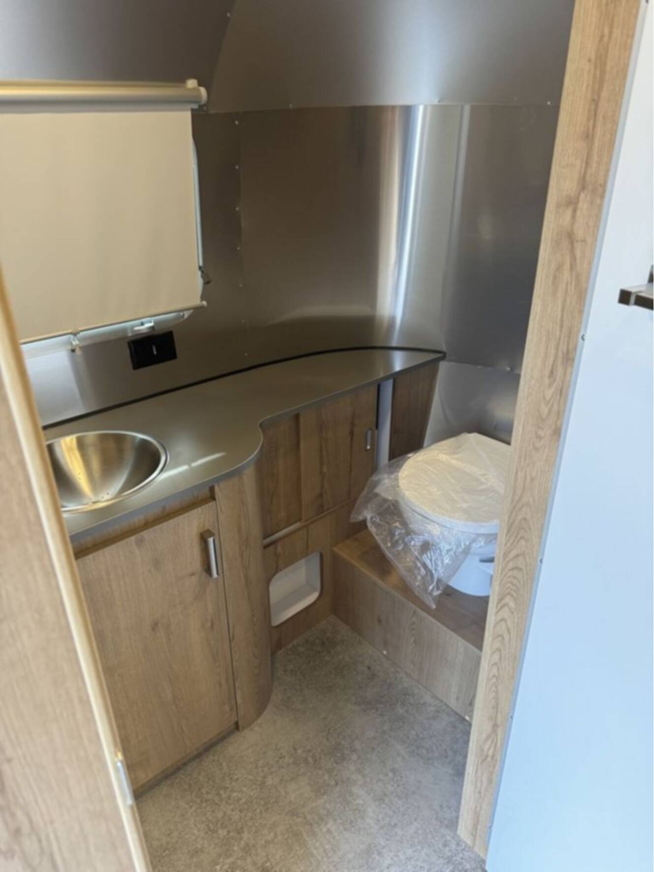 A photo of this 2025 Airstream Trade Wind 23FB