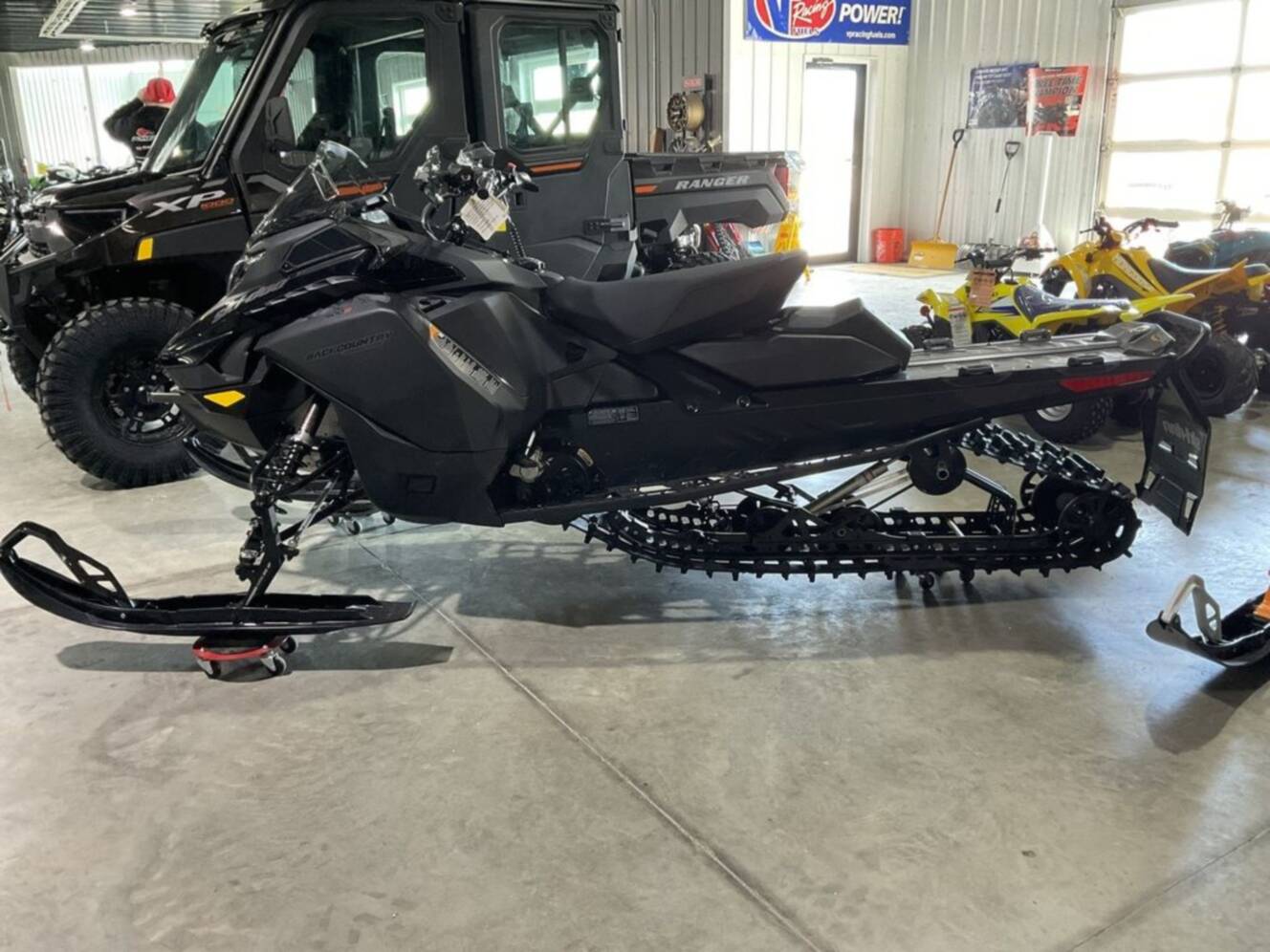 A photo of this 2026 Ski-Doo Backcountry Adrenaline® 600R E-TEC Storm 1.5_Black