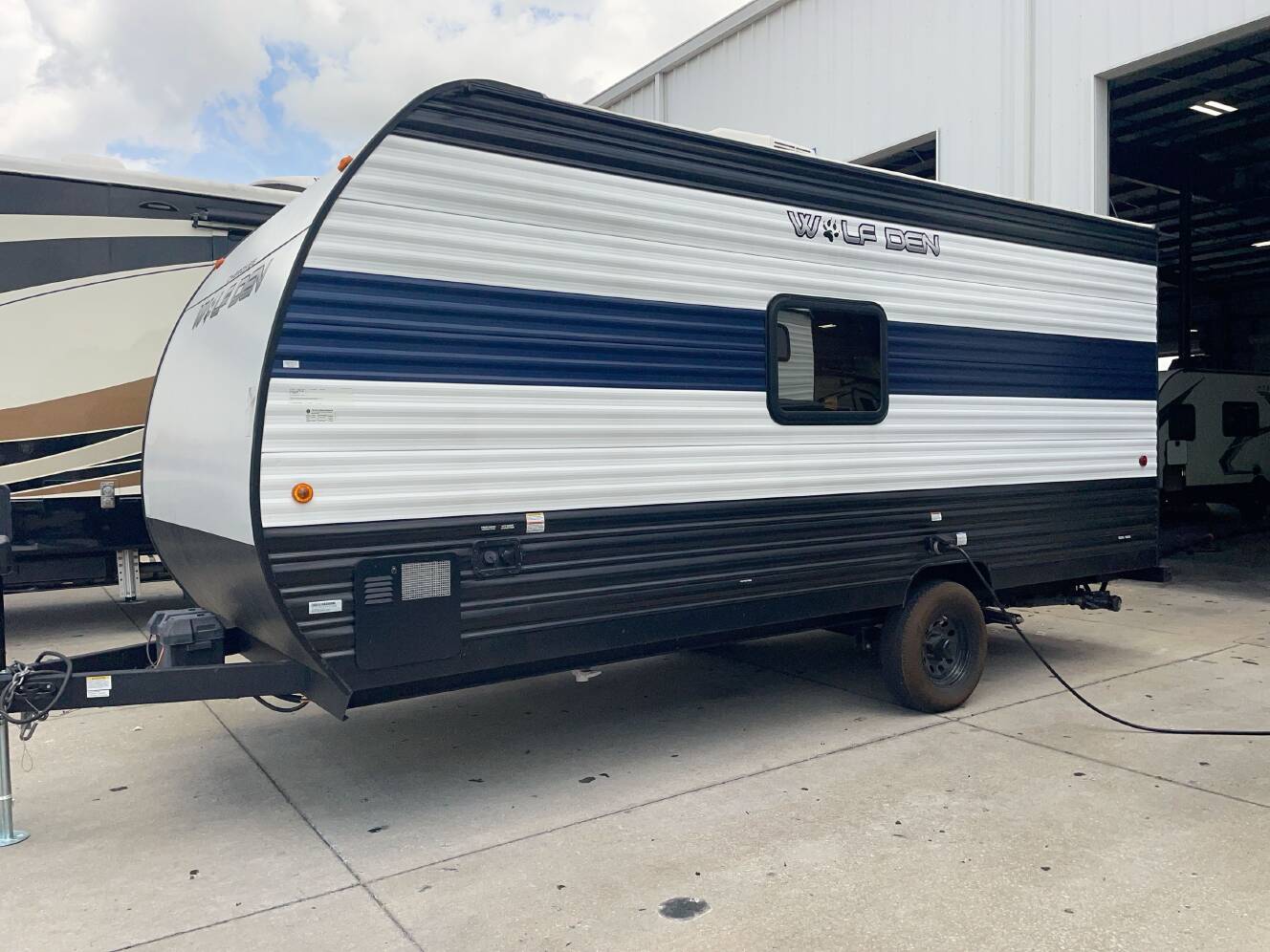 A photo of this 2024 Forest River WOLF DEN 16EV