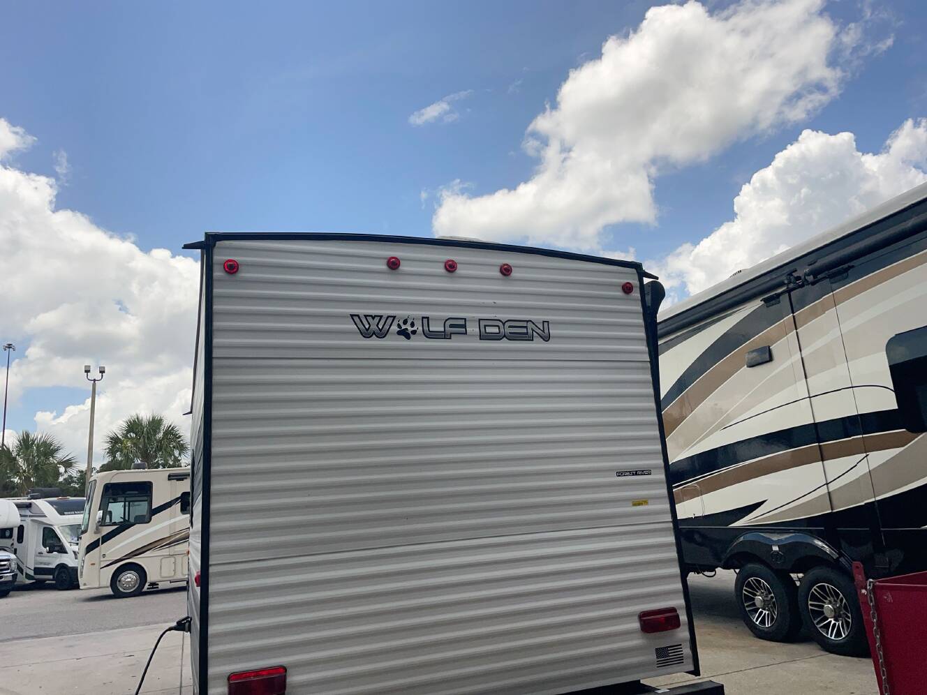 A photo of this 2024 Forest River WOLF DEN 16EV