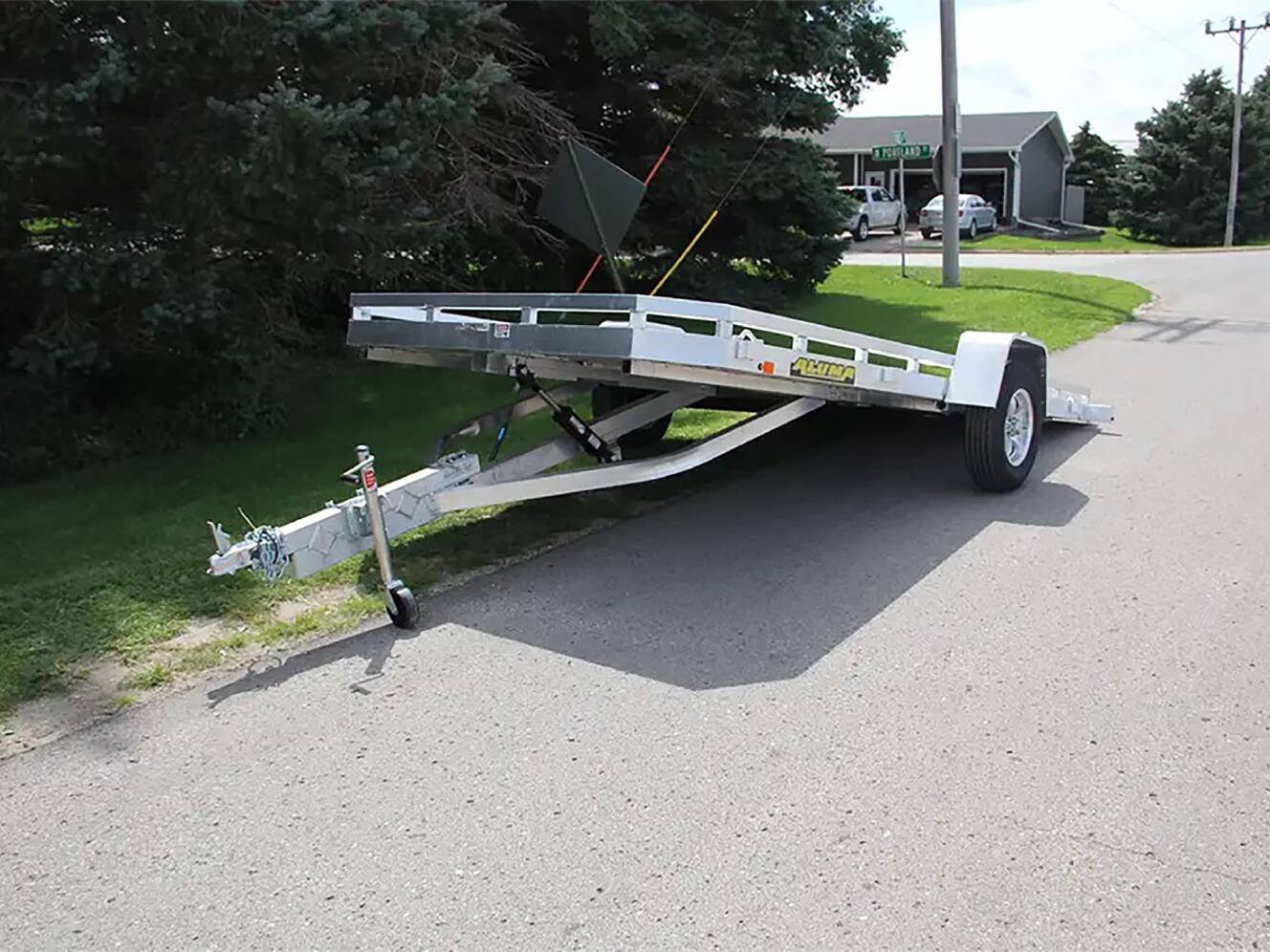 A photo of this 2024 Aluma Single Axle Tilt Utility Trailers 176 in.