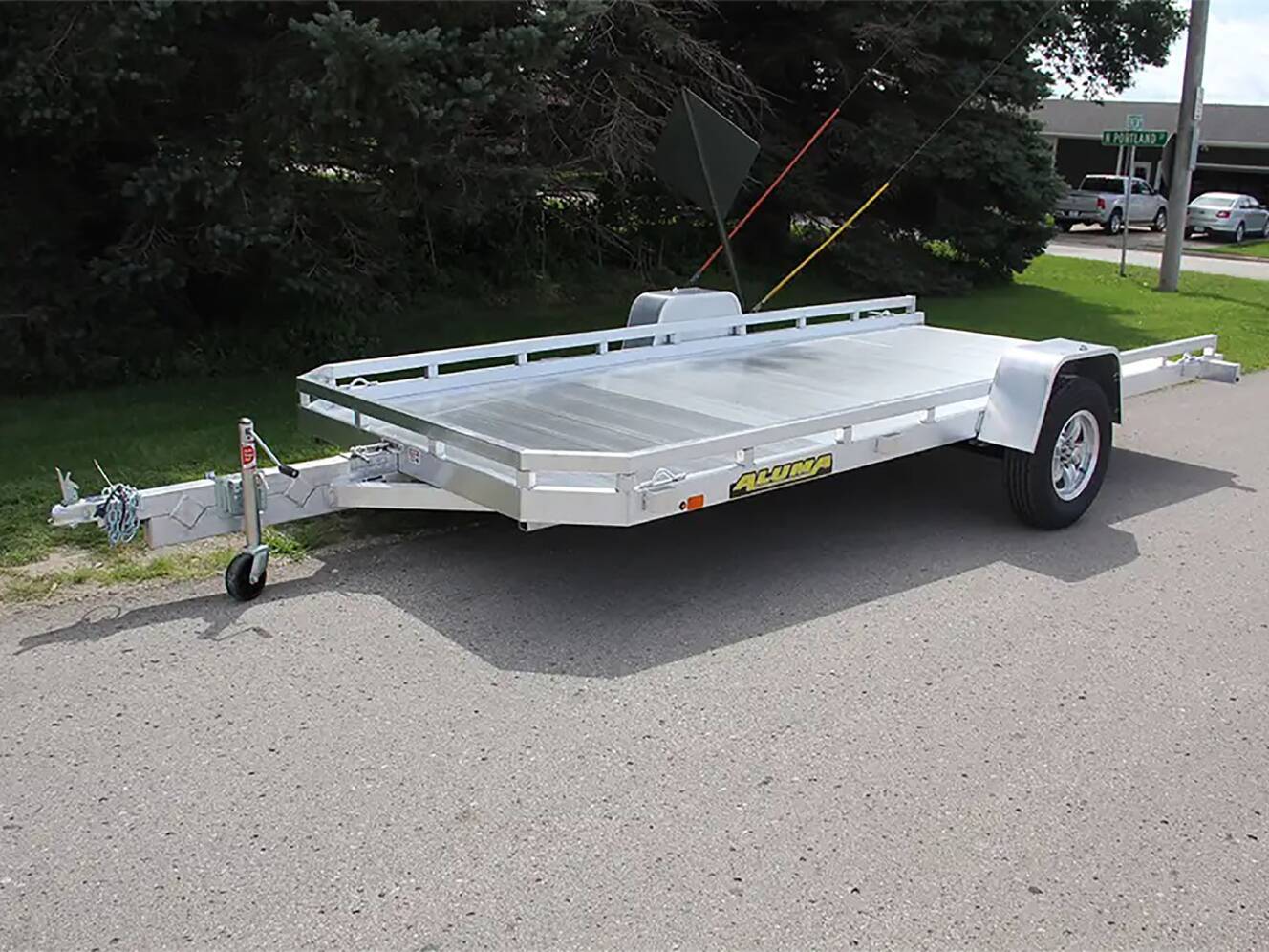 A photo of this 2024 Aluma Single Axle Tilt Utility Trailers 176 in.