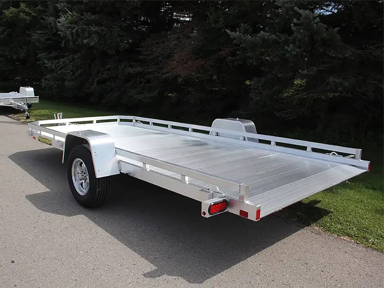 A photo of this 2024 Aluma Single Axle Tilt Utility Trailers 176 in.