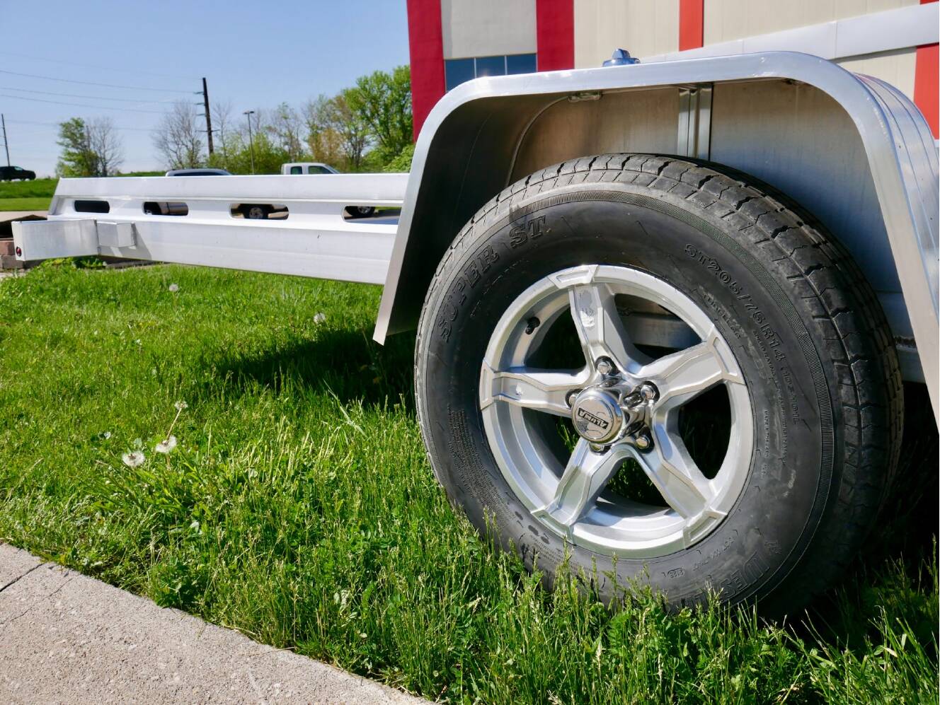 A photo of this 2024 Aluma Single Axle Tilt Utility Trailers 176 in.