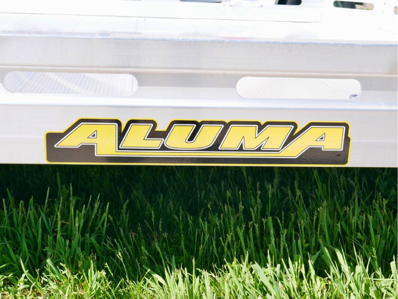 A photo of this 2024 Aluma Single Axle Tilt Utility Trailers 176 in.