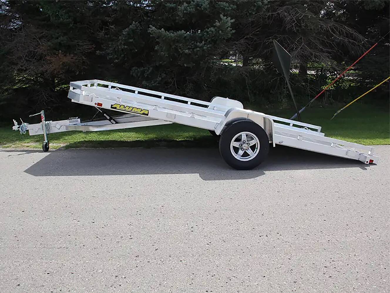 A photo of this 2024 Aluma Single Axle Tilt Utility Trailers 176 in.