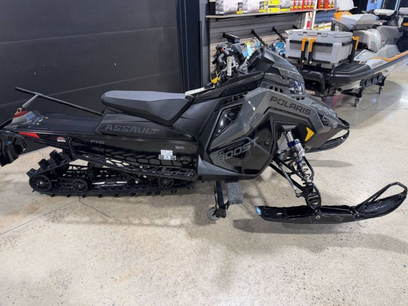 A photo of this 2025 Polaris® Boost Switchback Assault 146 Shadow Gray / Gloss Black