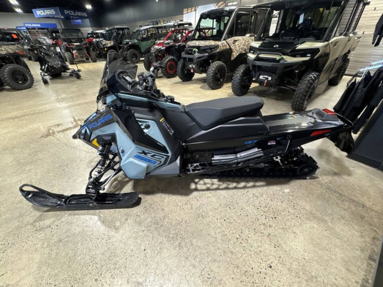 A photo of this 2026 Polaris® 650 INDY XC 137 Gloss Black / Blue Dusk