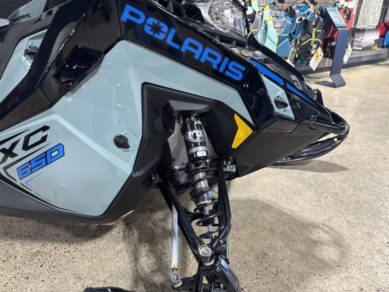 A photo of this 2026 Polaris® 650 INDY XC 137 Gloss Black / Blue Dusk