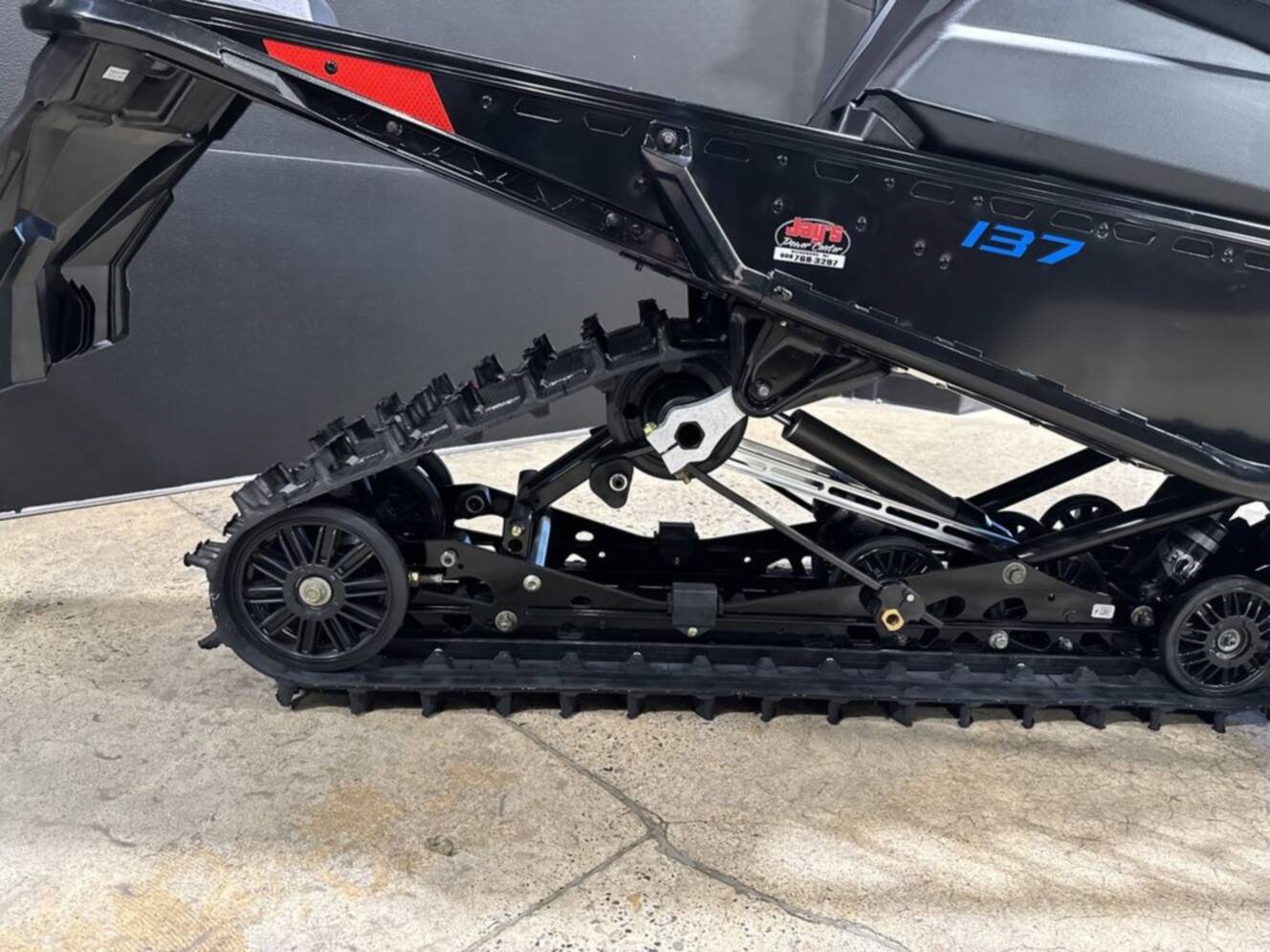 A photo of this 2026 Polaris® 650 INDY XC 137 Gloss Black / Blue Dusk