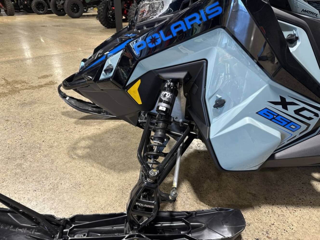 A photo of this 2026 Polaris® 650 INDY XC 137 Gloss Black / Blue Dusk