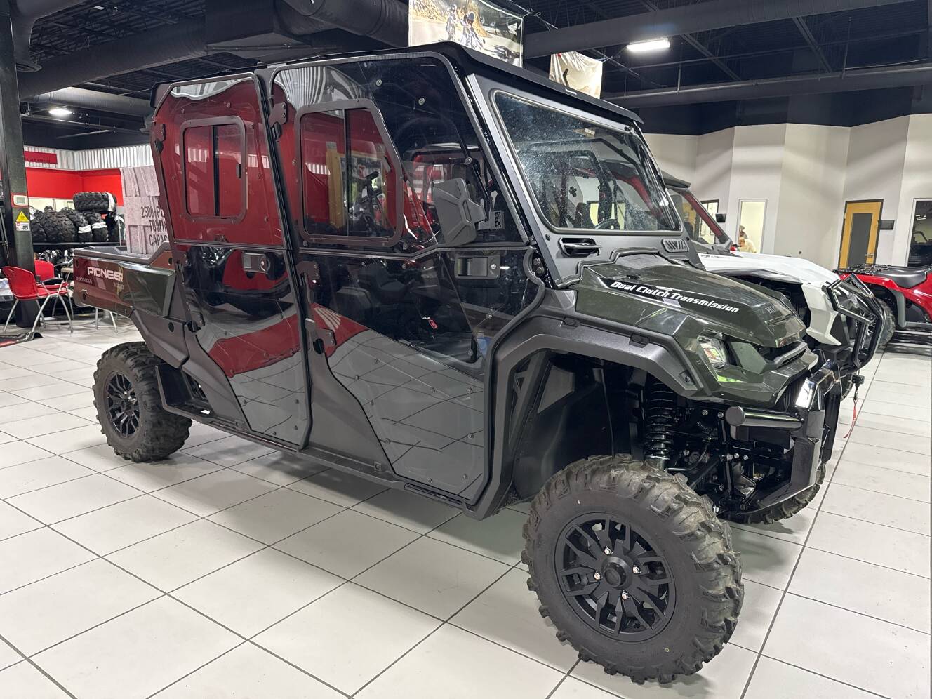 A photo of this 2025 Honda Pioneer 1000-6 Deluxe Crew