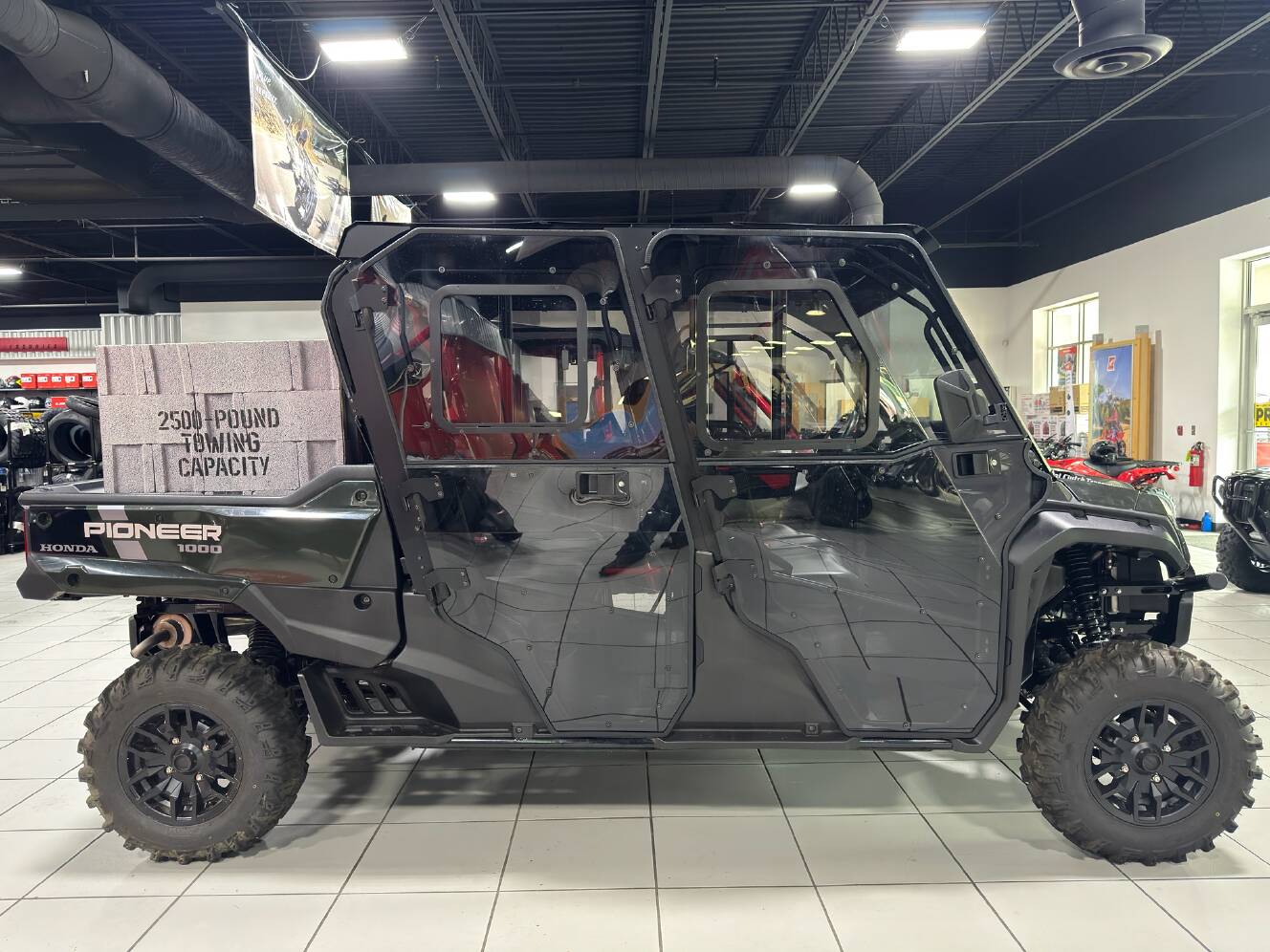 A photo of this 2025 Honda Pioneer 1000-6 Deluxe Crew