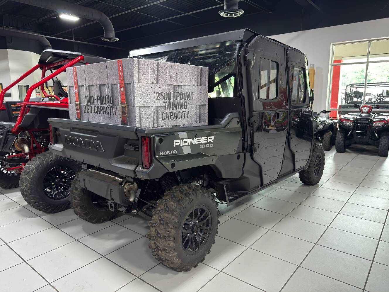 A photo of this 2025 Honda Pioneer 1000-6 Deluxe Crew