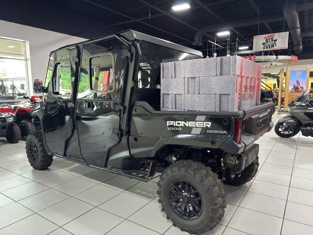 A photo of this 2025 Honda Pioneer 1000-6 Deluxe Crew