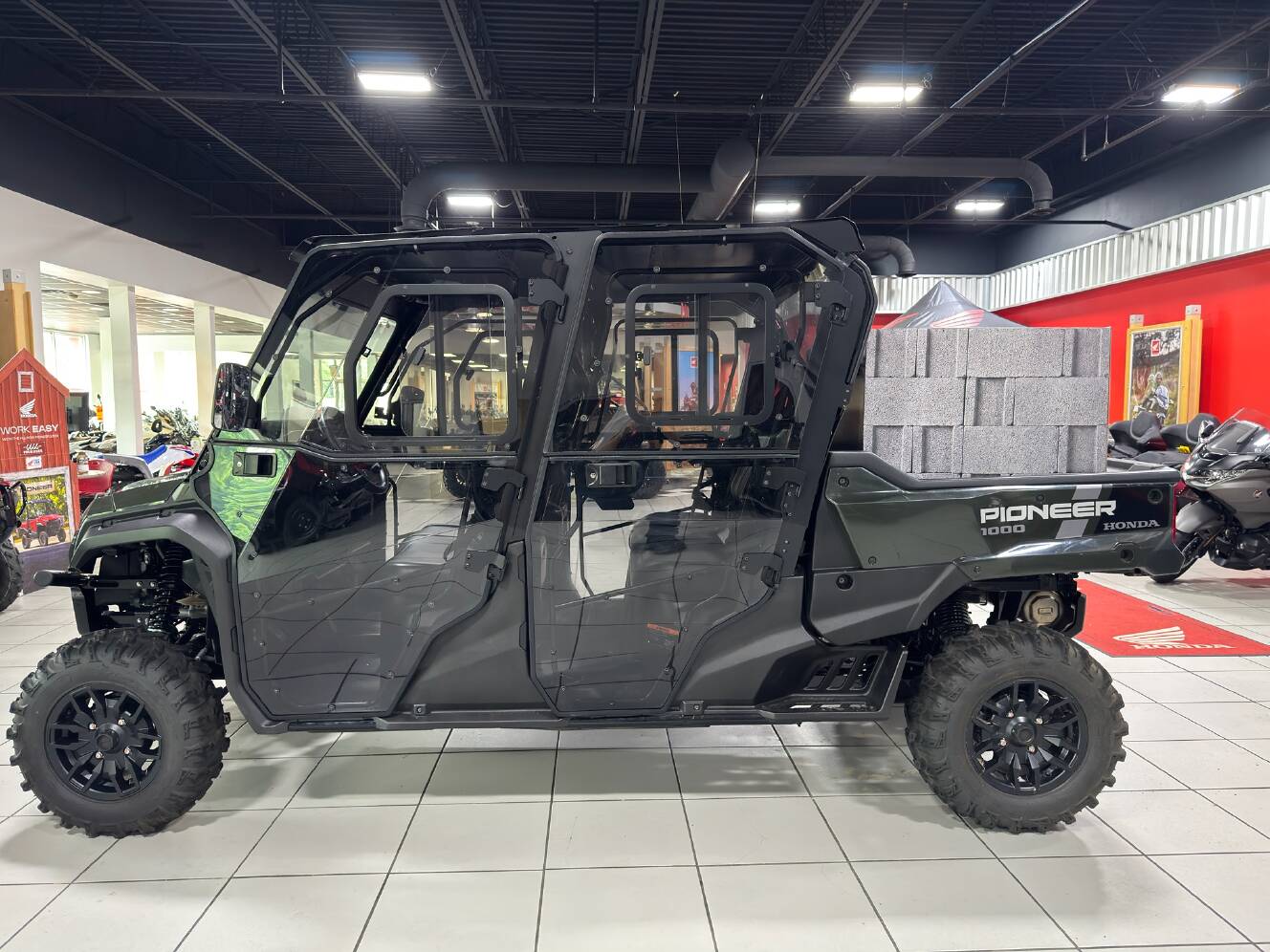 A photo of this 2025 Honda Pioneer 1000-6 Deluxe Crew