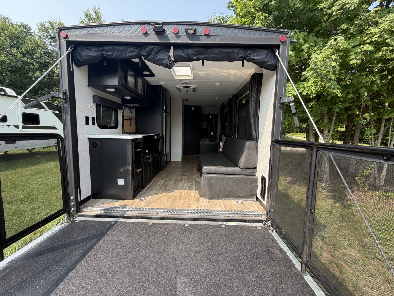 A photo of this 2022 Forest River CHEROKEE GREY WOLF BLACK LABEL TOY HAULER 18RRBL