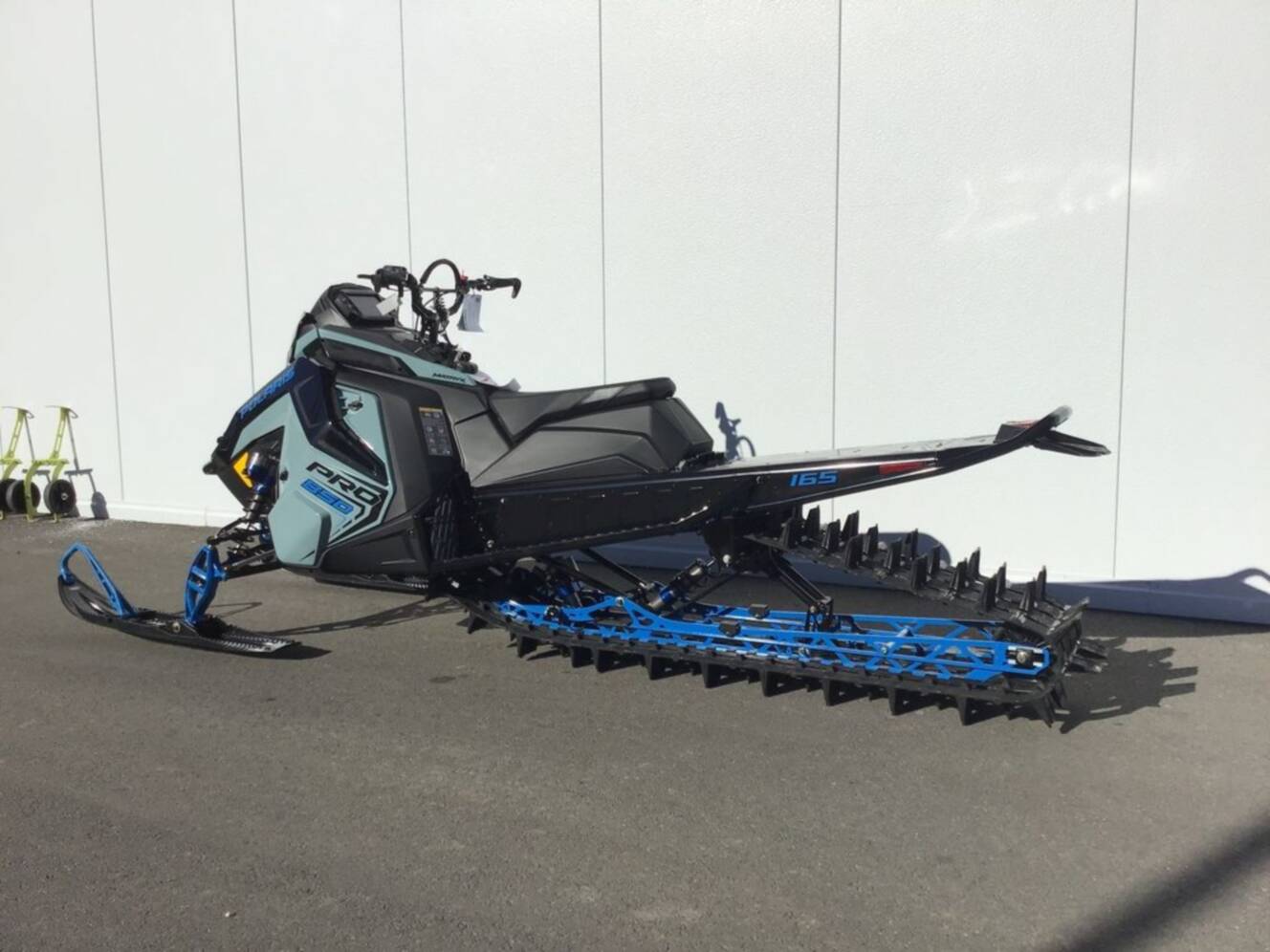 A photo of this 2026 Polaris® 850 PRO RMK 165 Hemlock Blue / Black / Velocity Blue