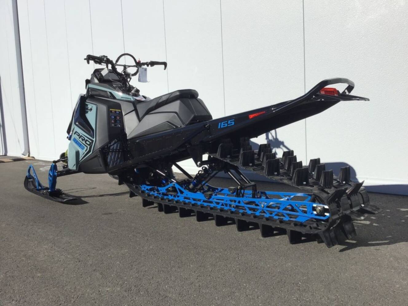 A photo of this 2026 Polaris® 850 PRO RMK 165 Hemlock Blue / Black / Velocity Blue
