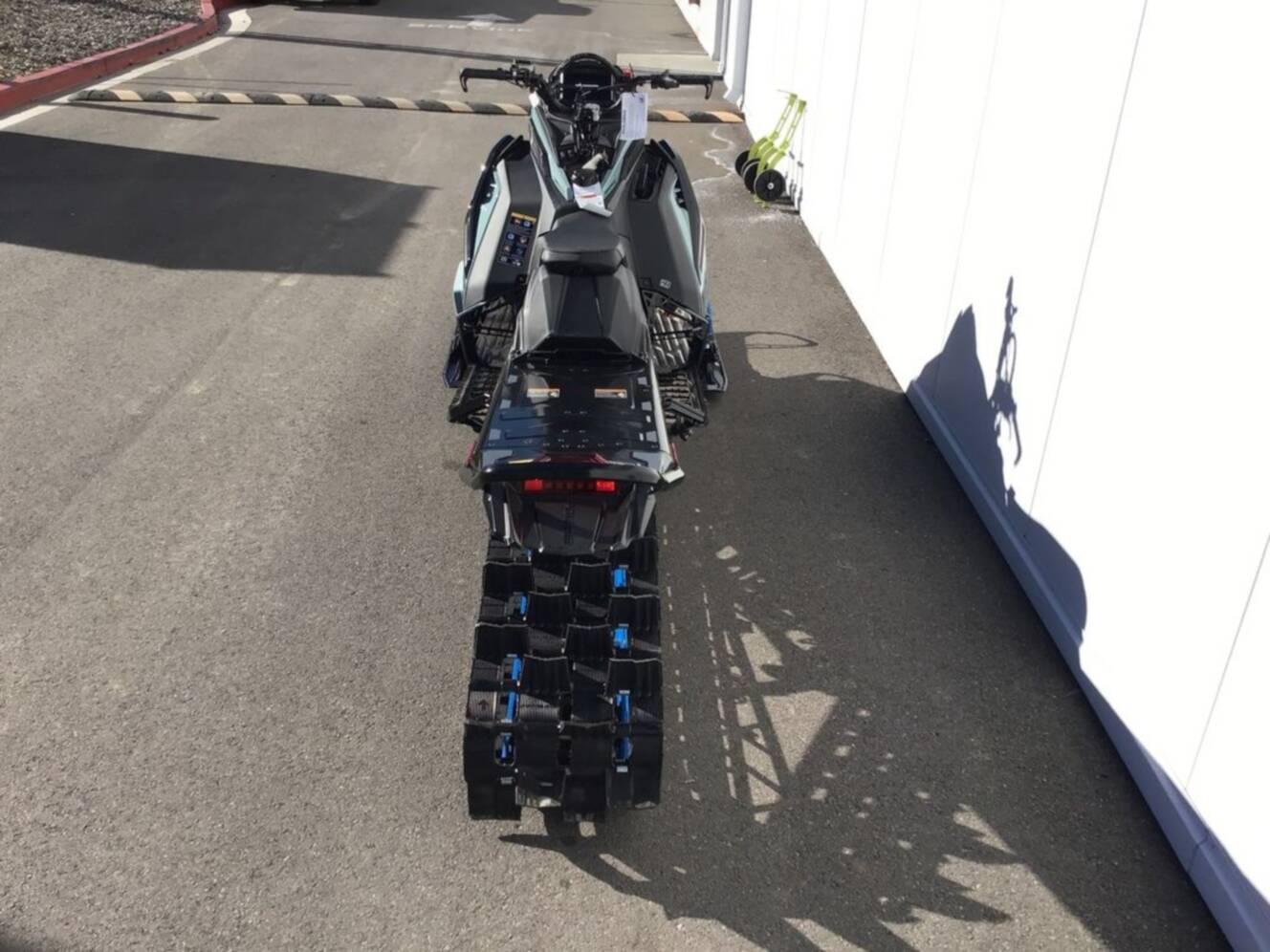 A photo of this 2026 Polaris® 850 PRO RMK 165 Hemlock Blue / Black / Velocity Blue