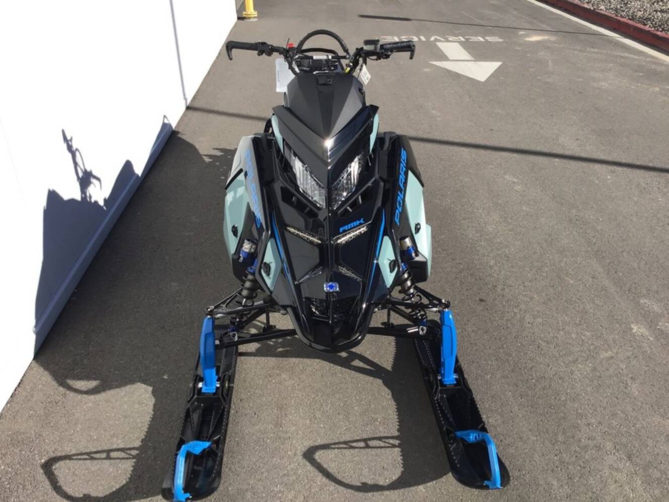 A photo of this 2026 Polaris® 850 PRO RMK 165 Hemlock Blue / Black / Velocity Blue