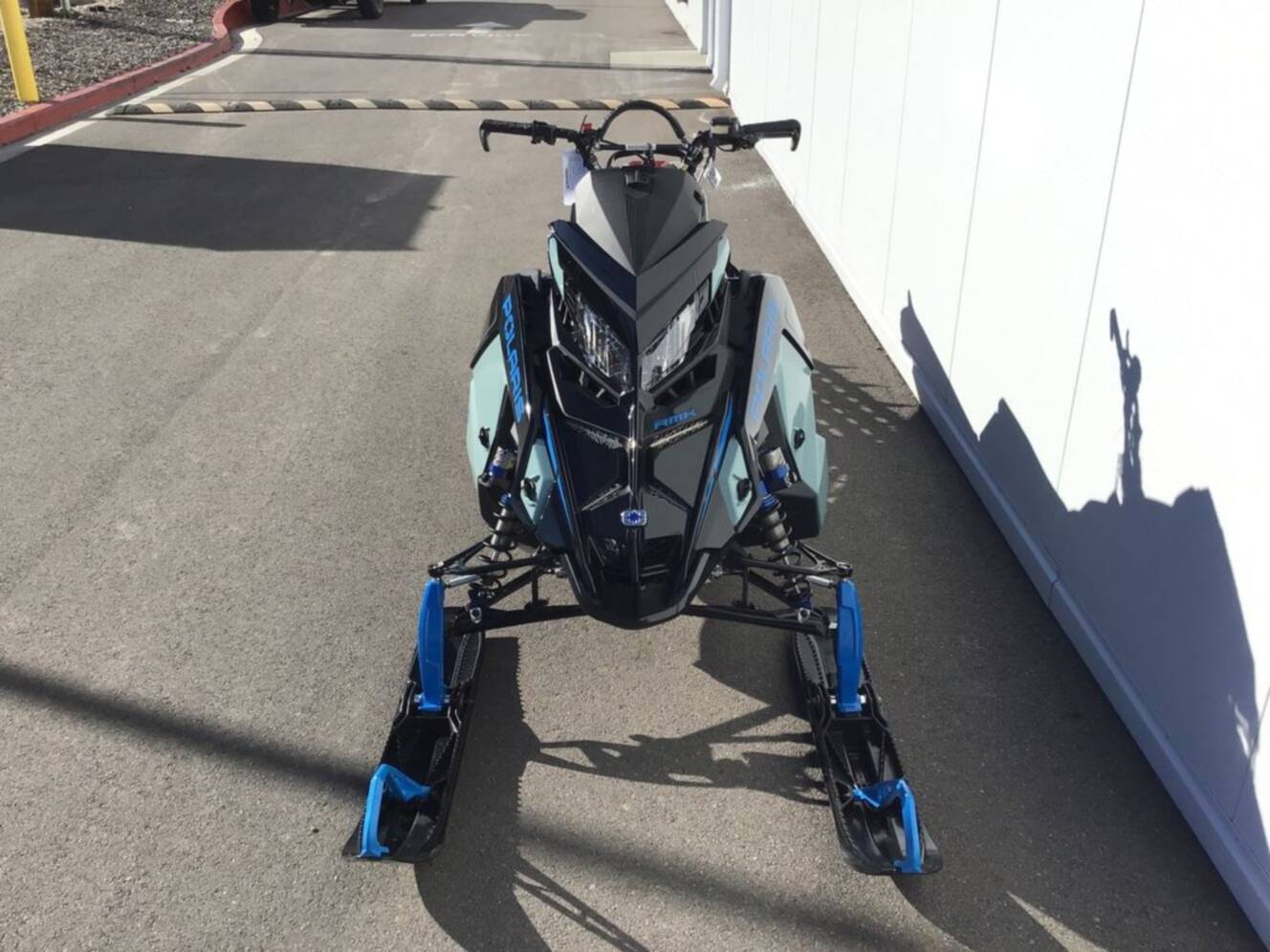 A photo of this 2026 Polaris® 850 PRO RMK 165 Hemlock Blue / Black / Velocity Blue
