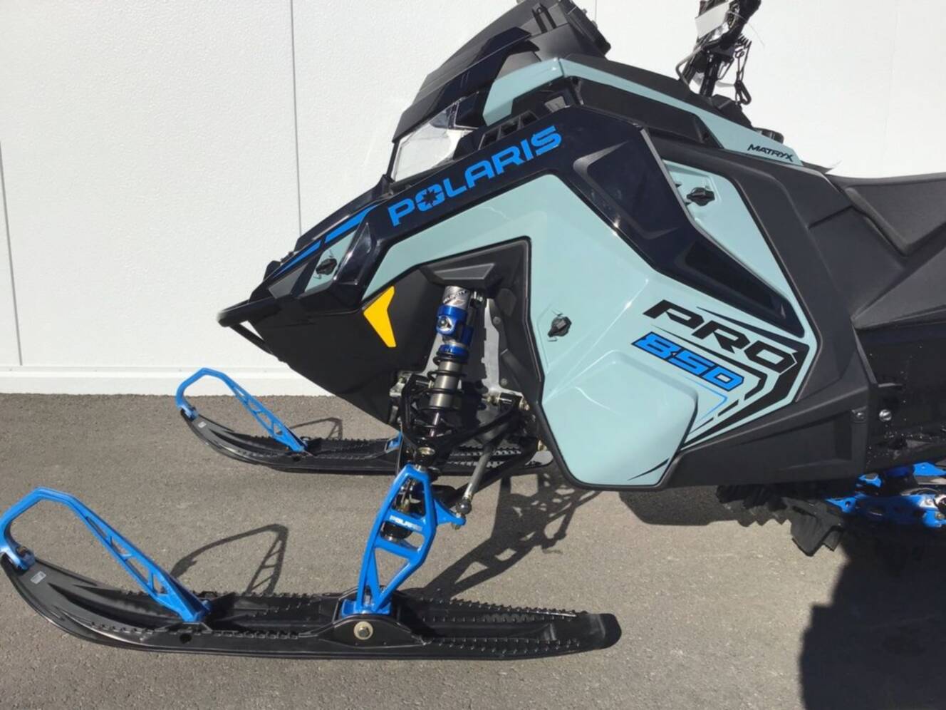 A photo of this 2026 Polaris® 850 PRO RMK 165 Hemlock Blue / Black / Velocity Blue