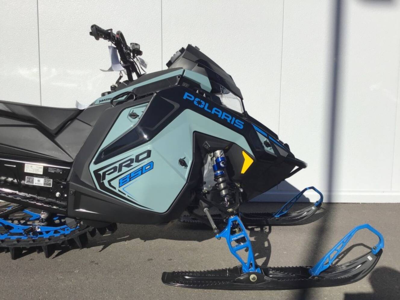 A photo of this 2026 Polaris® 850 PRO RMK 165 Hemlock Blue / Black / Velocity Blue