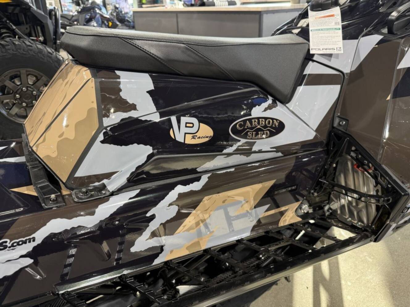 A photo of this 2026 Polaris Patriot Boost RMK Khaos 165 Gloss Black / Blue Dusk