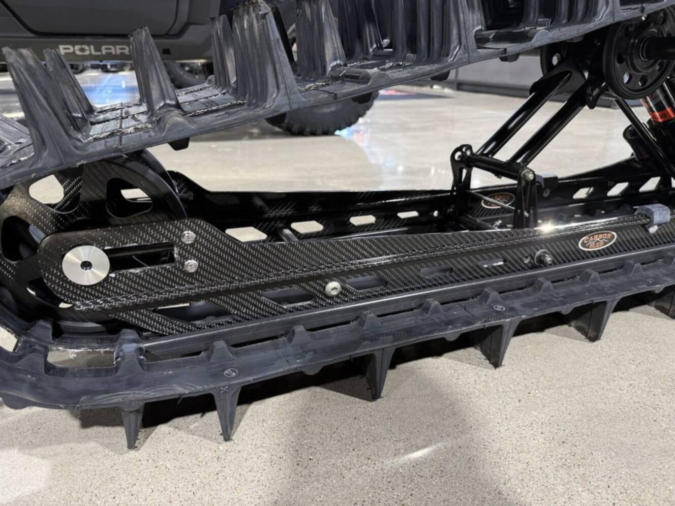 A photo of this 2026 Polaris Patriot Boost RMK Khaos 165 Gloss Black / Blue Dusk