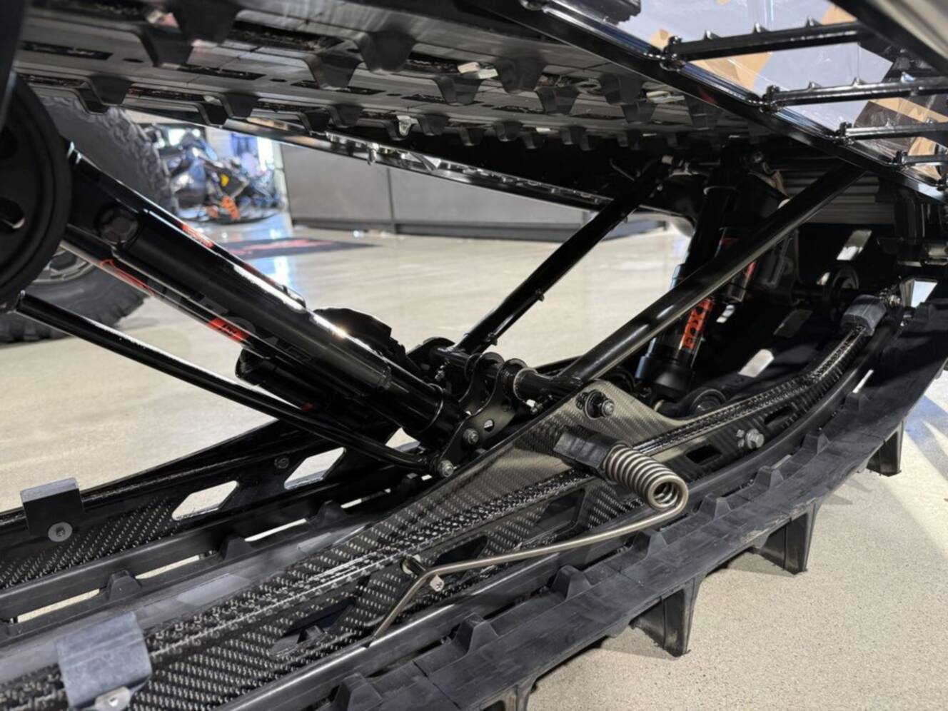 A photo of this 2026 Polaris Patriot Boost RMK Khaos 165 Gloss Black / Blue Dusk