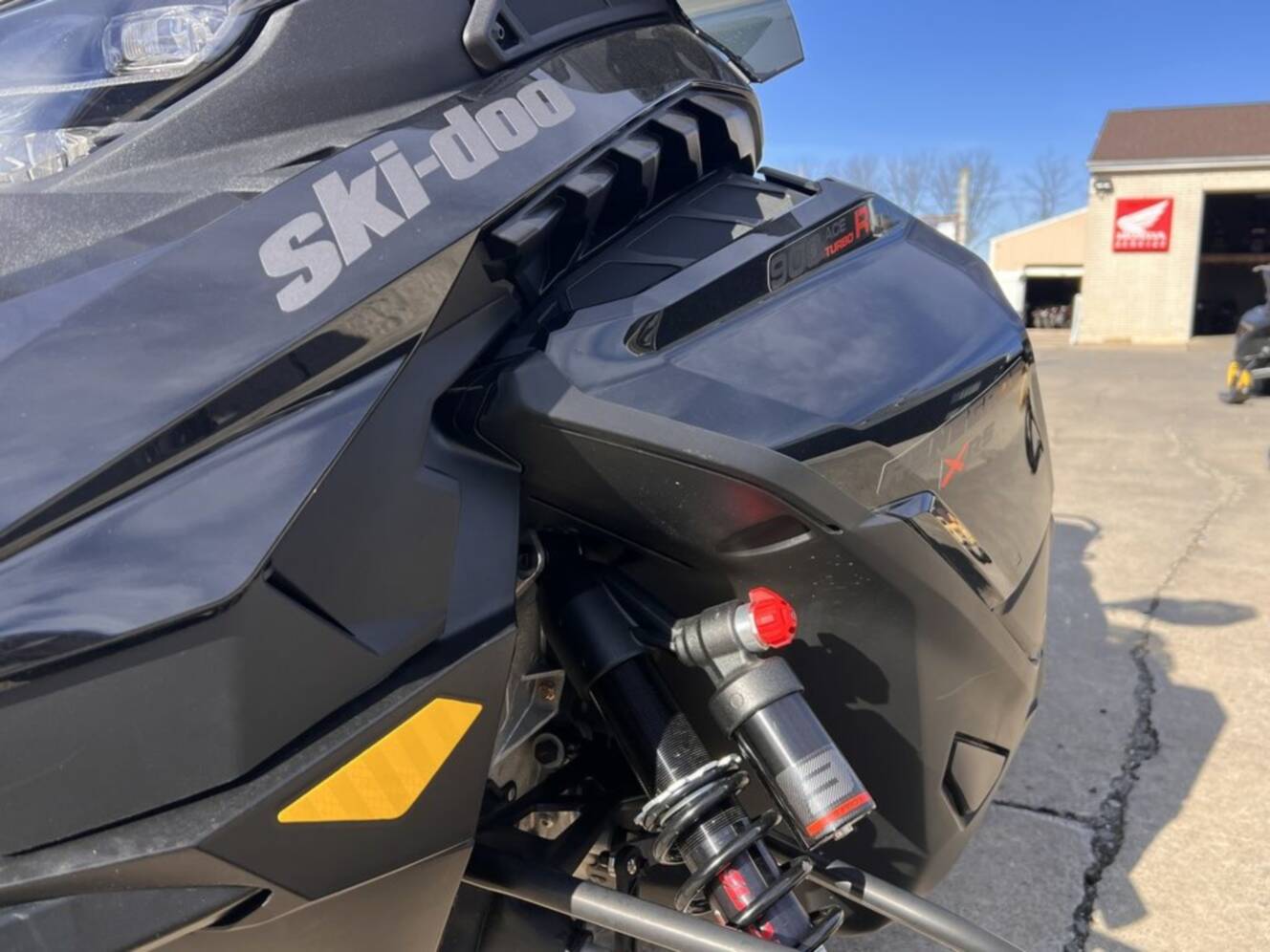A photo of this 2025 Ski-Doo Renegade® X-RS® 900 ACE Turbo R Ice R. XT 1.5 Std_7.2