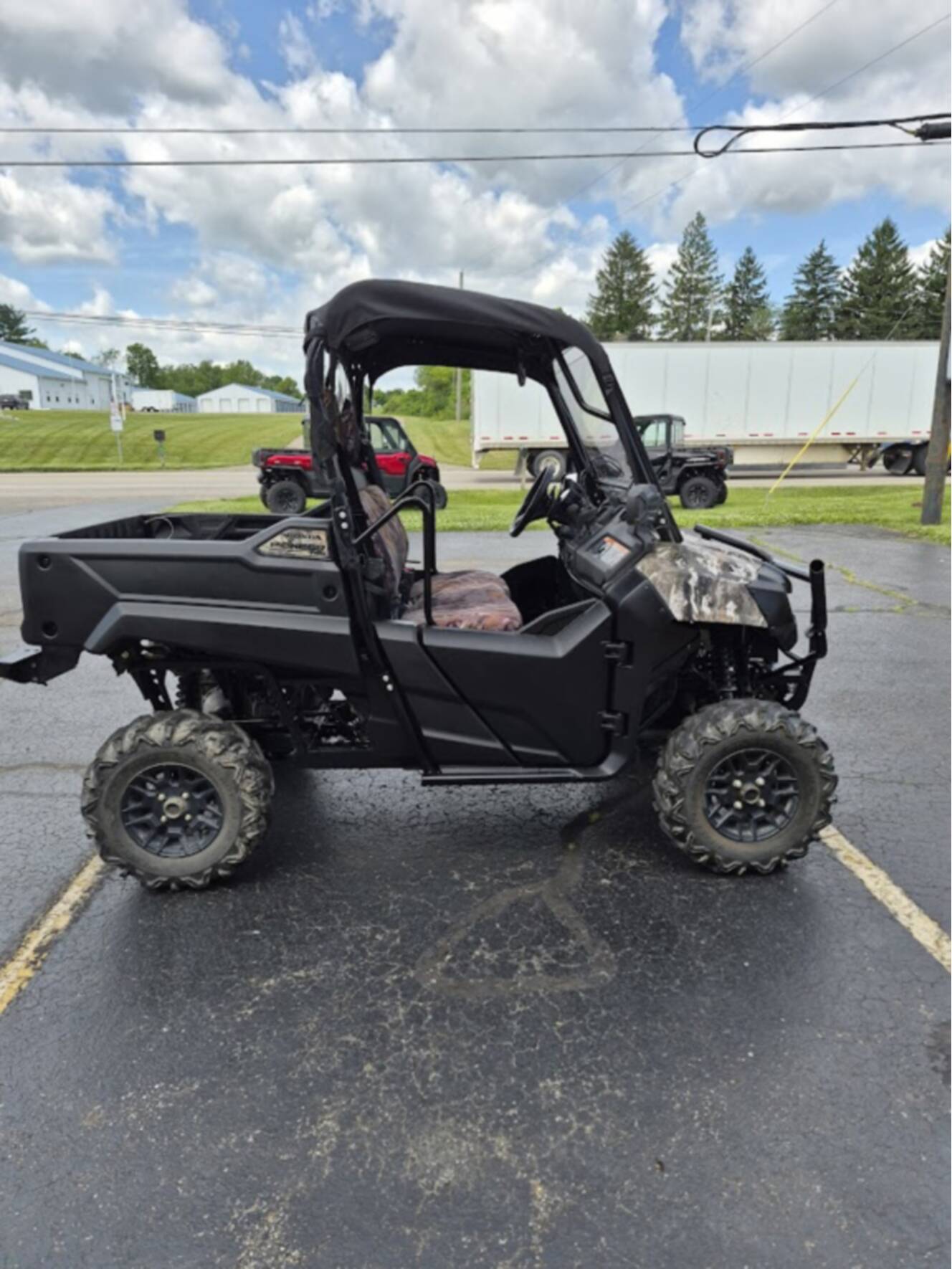 A photo of this 2025 Honda PIONEER 700 FOREST Deluxe