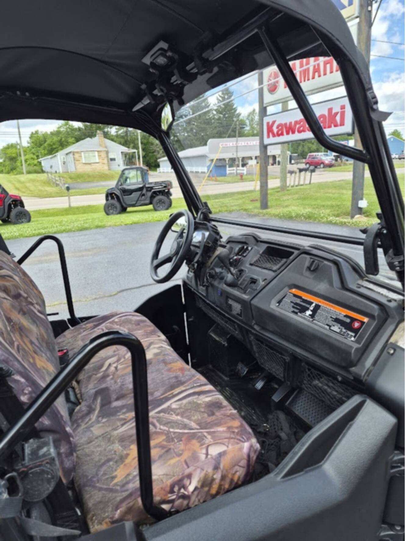 A photo of this 2025 Honda PIONEER 700 FOREST Deluxe