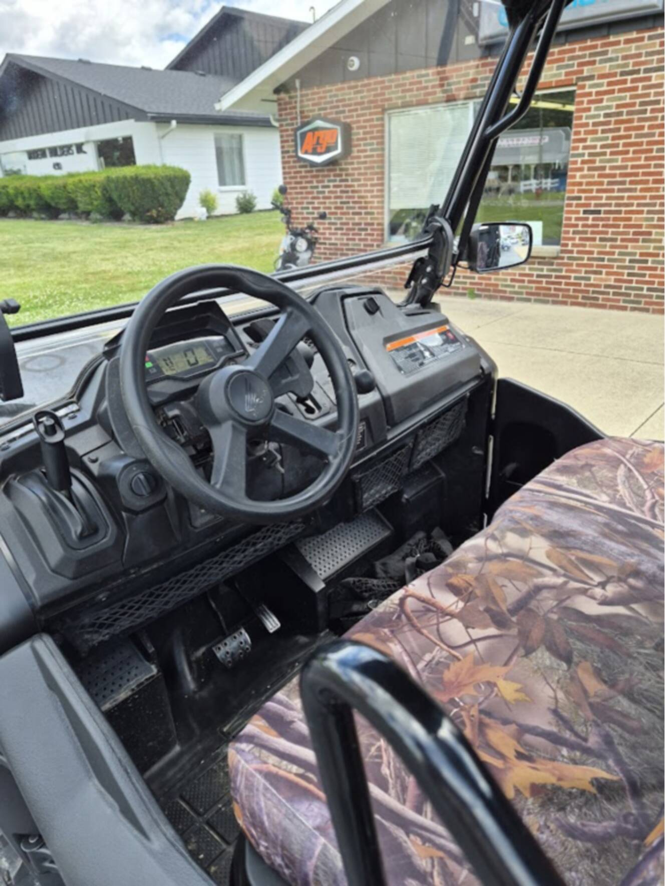 A photo of this 2025 Honda PIONEER 700 FOREST Deluxe