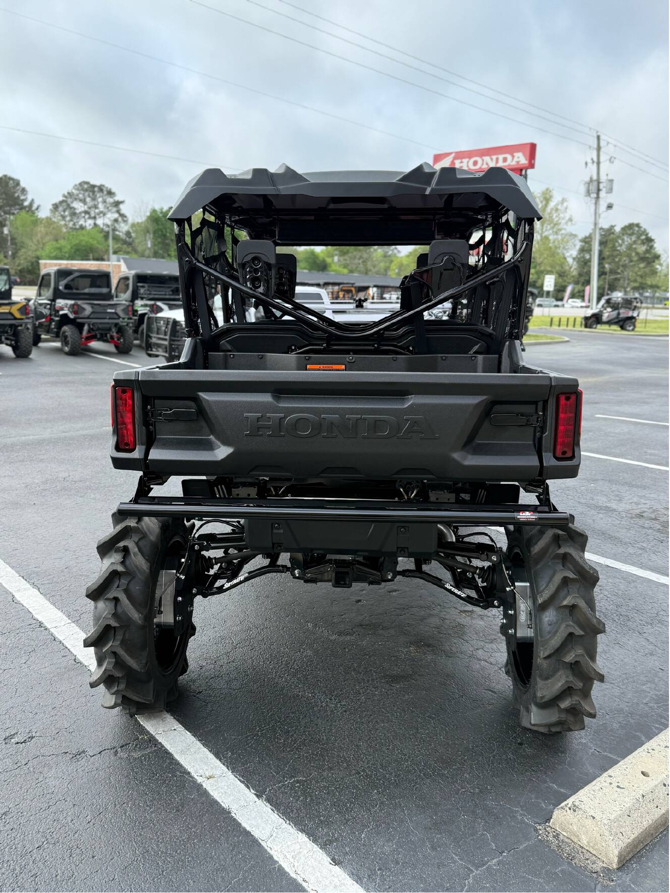 A photo of this 2025 Honda Pioneer 1000-6 Deluxe Crew
