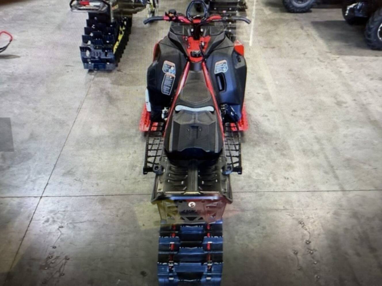 A photo of this 2026 Lynx® Shredder RE 850 E-TEC Turbo R 3700 Pow_2.5_10.25in_Red