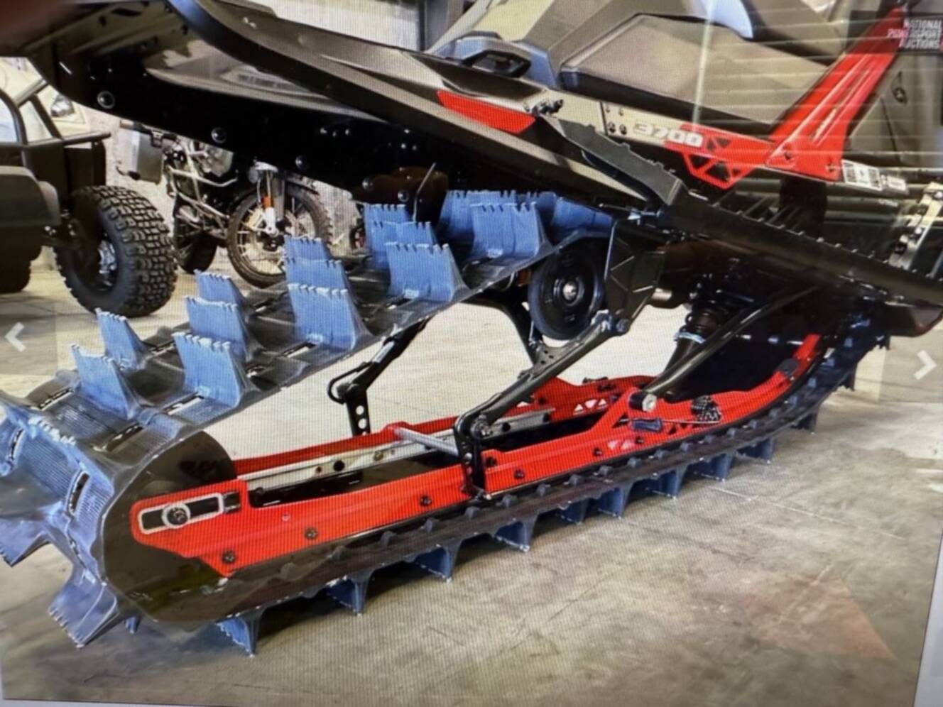 A photo of this 2026 Lynx® Shredder RE 850 E-TEC Turbo R 3700 Pow_2.5_10.25in_Red