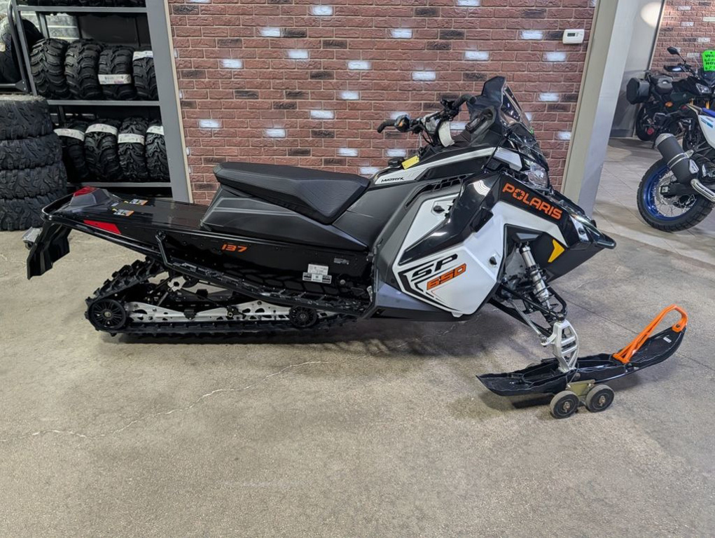 2027 Polaris  650 INDY SP 137 White Lightning / Gloss Black / Orange  650 137 WHITE LIGHTNING in dimondale MI
